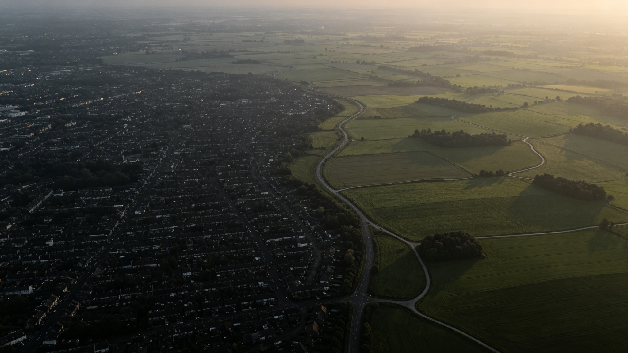 Aerial view of a developed area transitioning into agricultural land